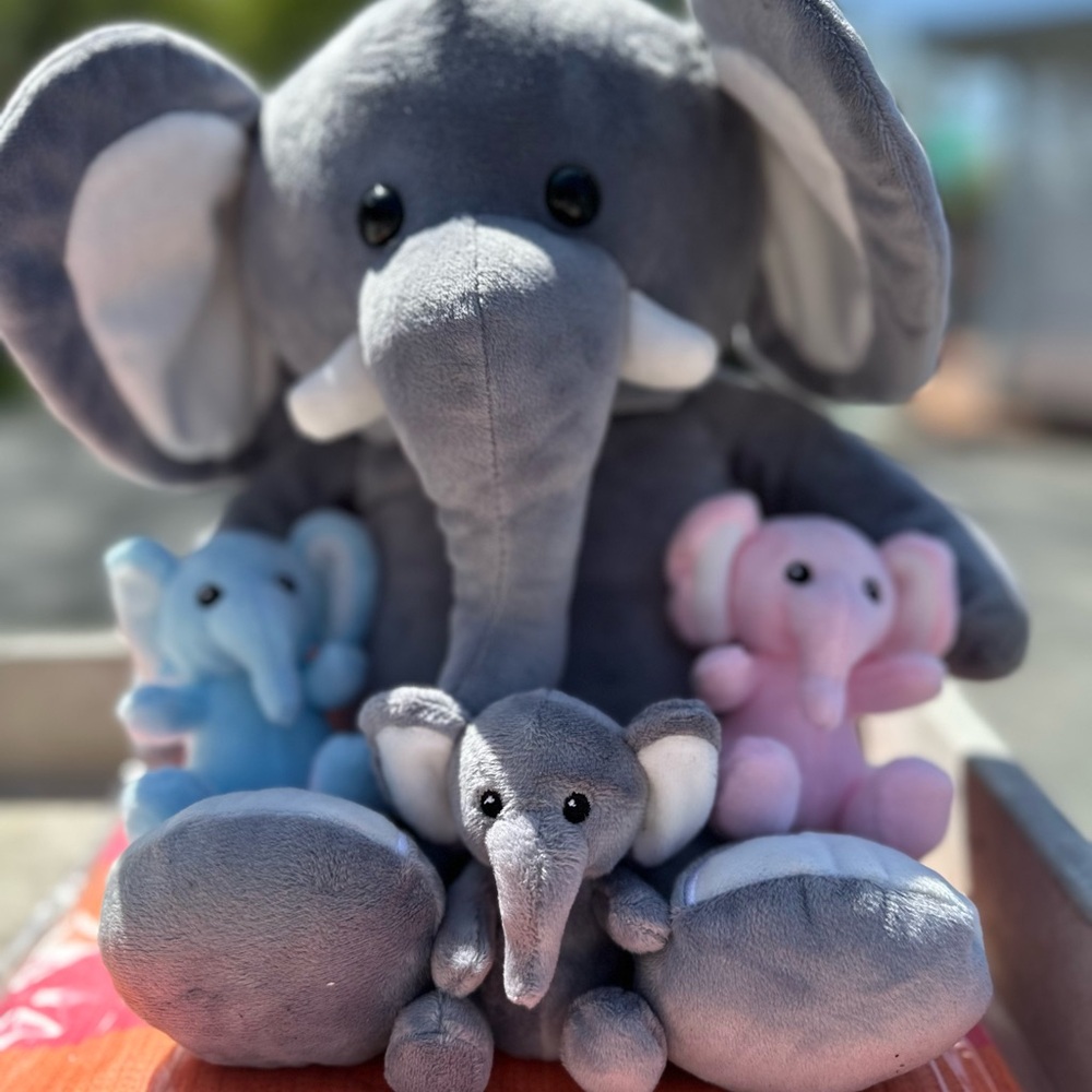 Elephant plushy mamma with 3 babies hidden inside. Great gift for baby/mom to be